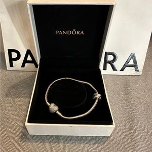 7.9 Pre Loved Pandora bracelet with charm.